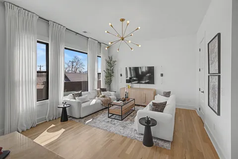 a view of a living room and dining room