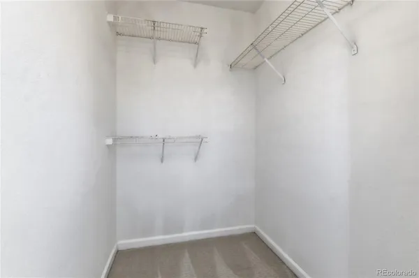 a bathroom with a toilet sink and shower