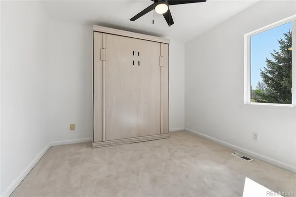 a view of wooden floor in an empty room