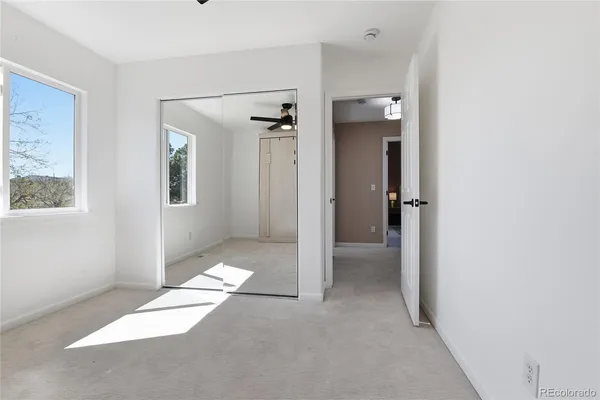 a view of a room with wooden floors and led lights