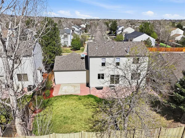 a front view of a house with yard and garage