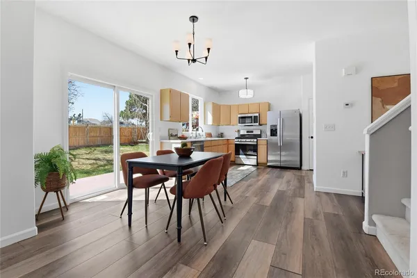 a view of a dining room with furniture window and wooden floor