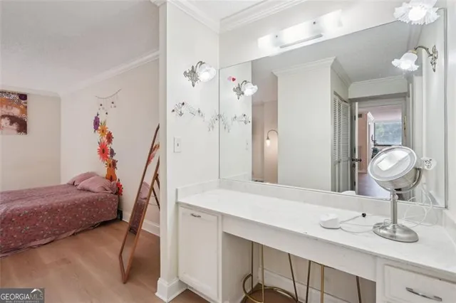 a en suite bathroom with a sink double vanity and shower