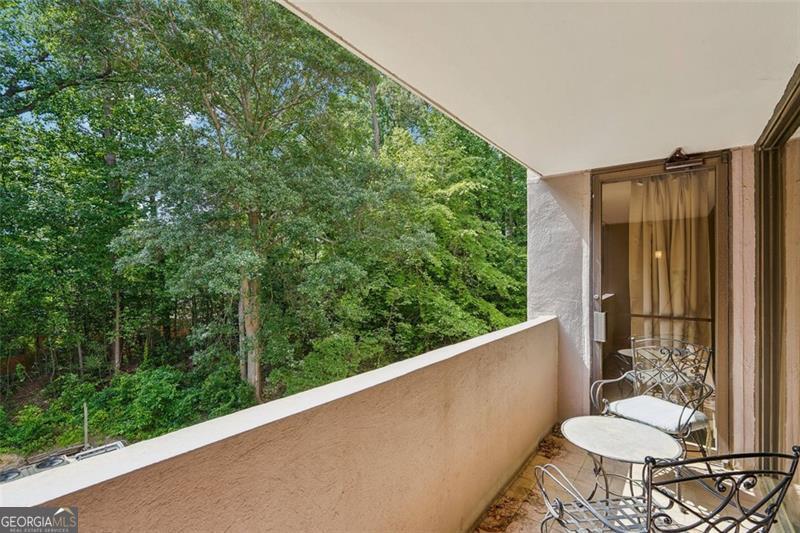 3530 Piedmont Road Northeast, Unit 2I Atlanta, GA 30305 - Photo 18 of 26 a view of a balcony and chair