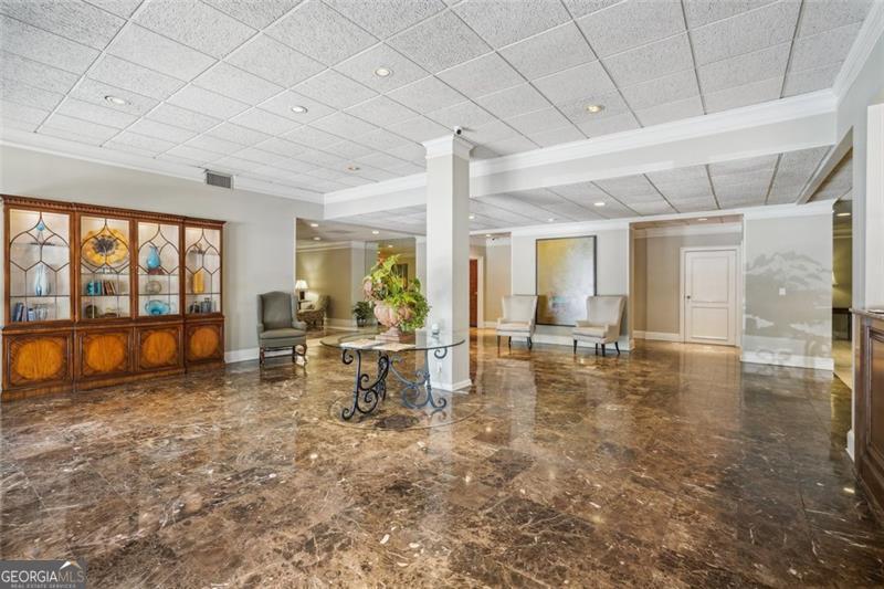 3530 Piedmont Road Northeast, Unit 2I Atlanta, GA 30305 - Photo 20 of 26 a view of a living room with a flat screen tv