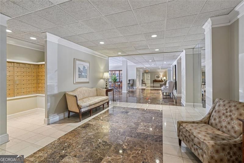 3530 Piedmont Road Northeast, Unit 2I Atlanta, GA 30305 - Photo 21 of 26 a living room with furniture and a large window