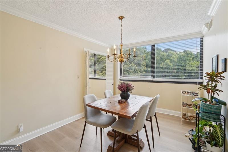 3530 Piedmont Road Northeast, Unit 2I Atlanta, GA 30305 - Photo 4 of 26 a view of a dining room with furniture window and outside view