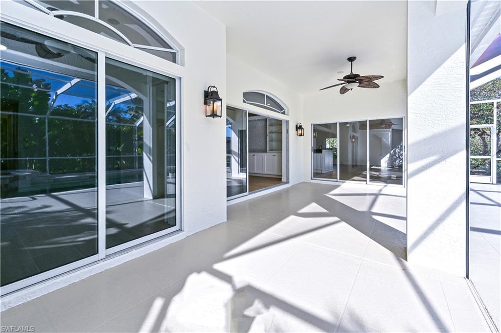 2312 Harrier Run Naples, FL 34105 - Photo 13 of 21 a spacious bathroom with a glass shower door and a sink