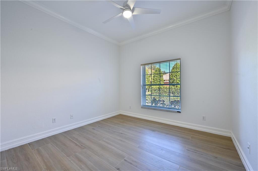2312 Harrier Run Naples, FL 34105 - Photo 19 of 21 wooden floor in an empty room with a window