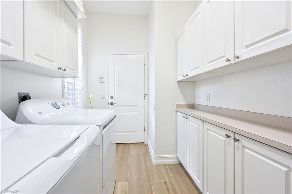 2312 Harrier Run Naples, FL 34105 - Photo 20 of 21 a bathroom with a sink and a mirror