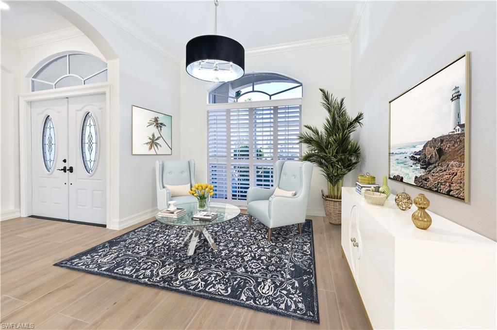 2312 Harrier Run Naples, FL 34105 - Photo 6 of 21 a living room with furniture and a large window