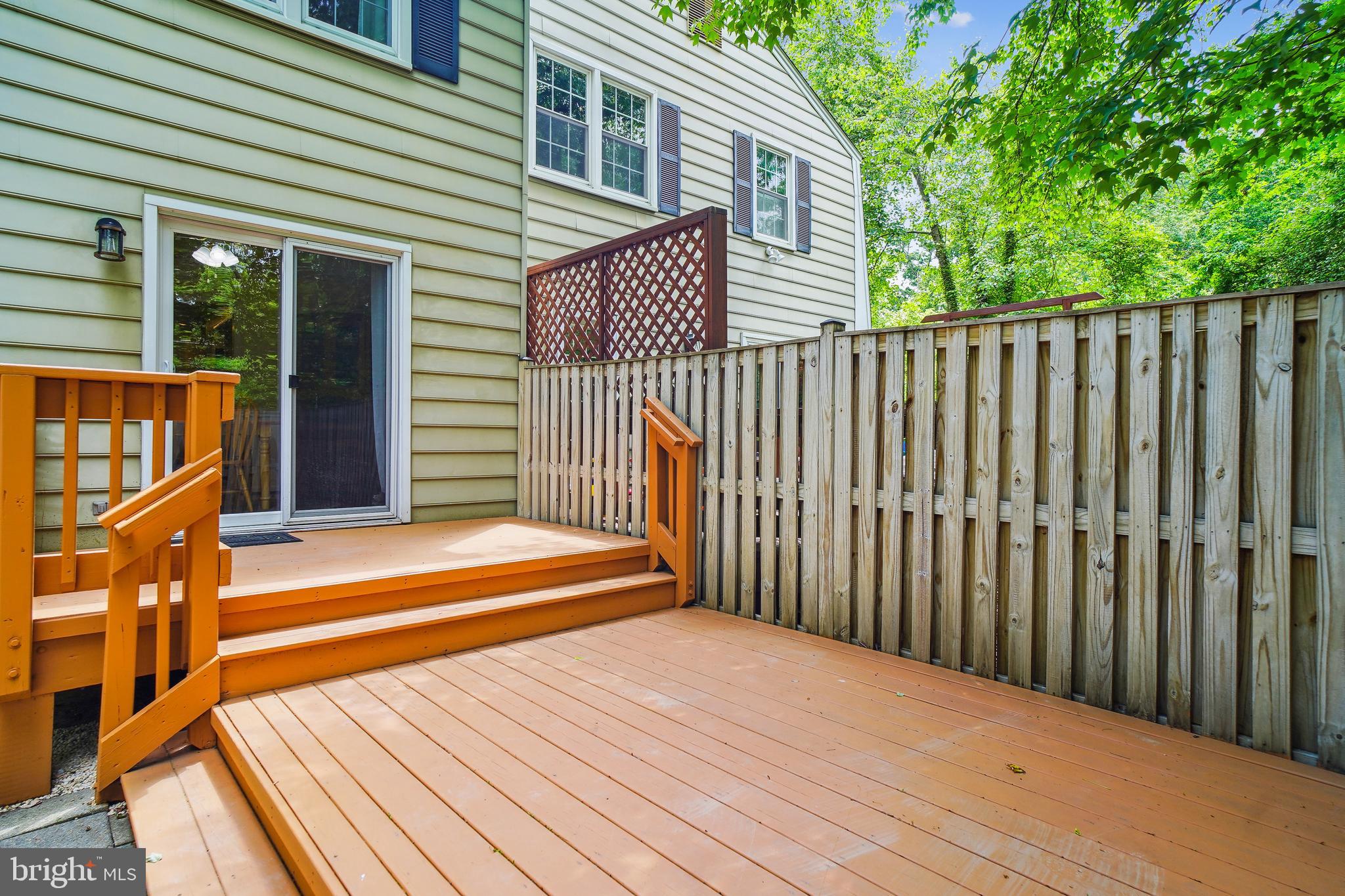 1049 Windrush Lane, Unit 2 Sandy Spring, MD 20860 - Photo 45 of 59 a view of a wooden balcony