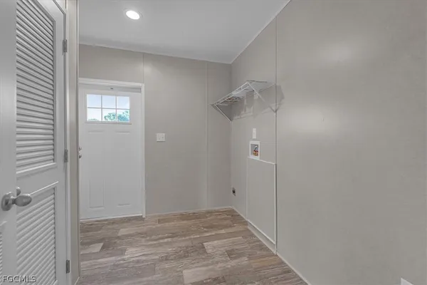 a view of an empty room with a window