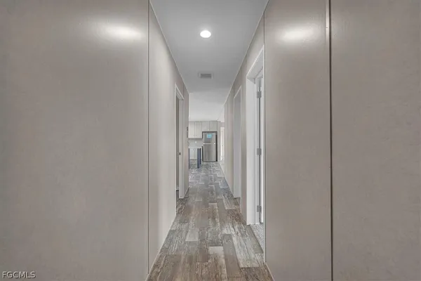 a spacious bedroom with a bed and a window