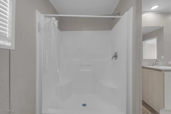 a bathroom with a double vanity sink and a toilet