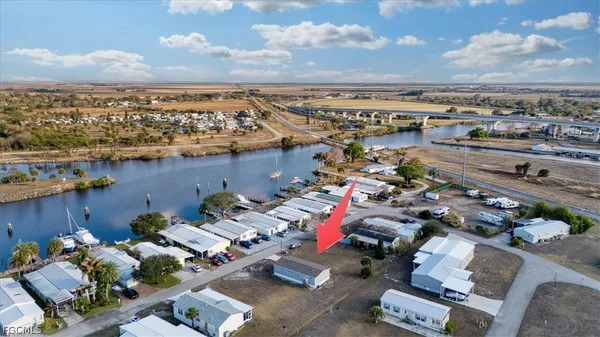 an aerial view of a house with a ocean view