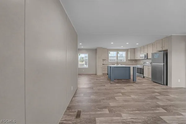 a view of a kitchen with a sink and cabinets