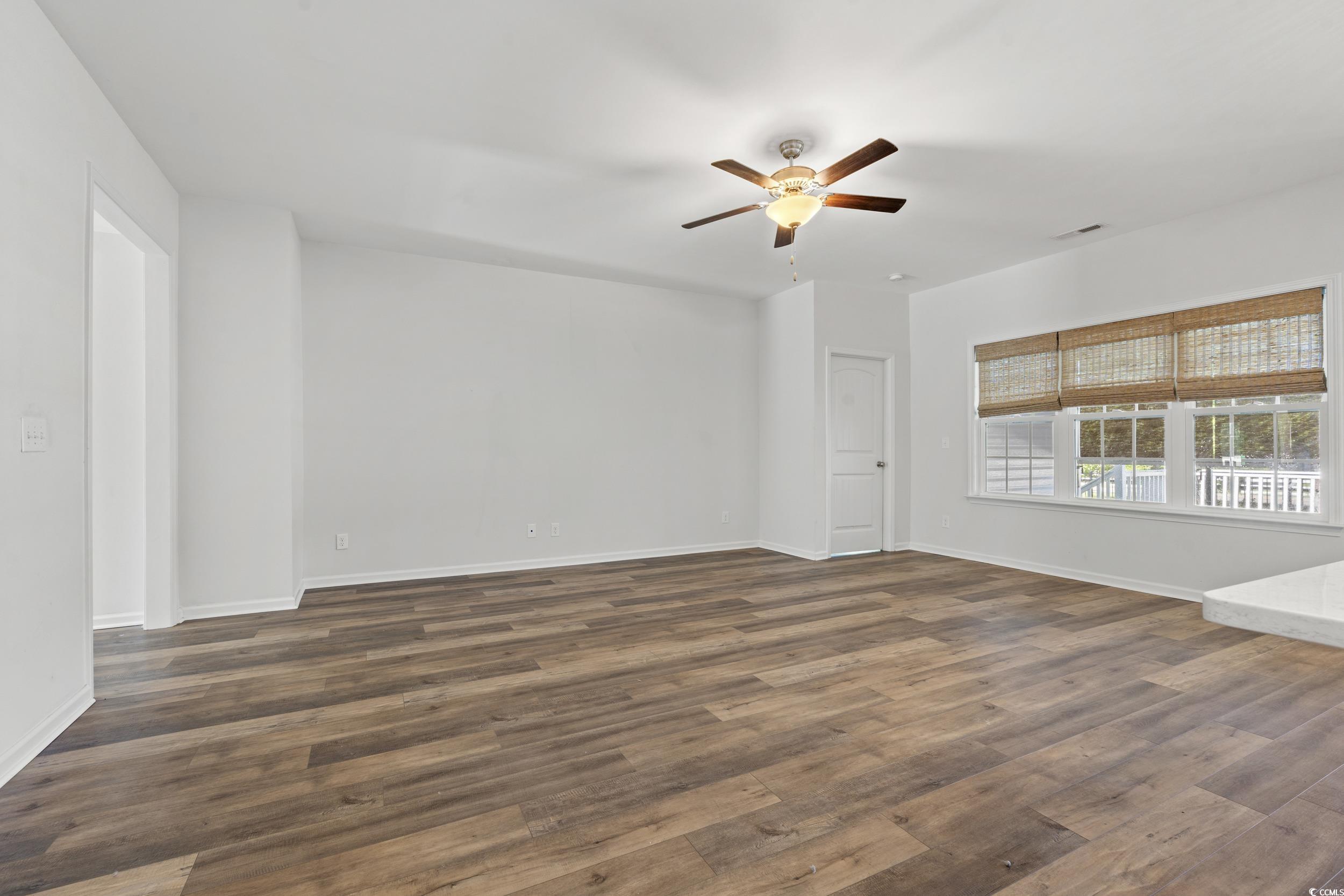 3026 Millstone Place Georgetown, SC 29440 - Photo 17 of 34 Unfurnished room with a ceiling fan and dark wood-type flooring