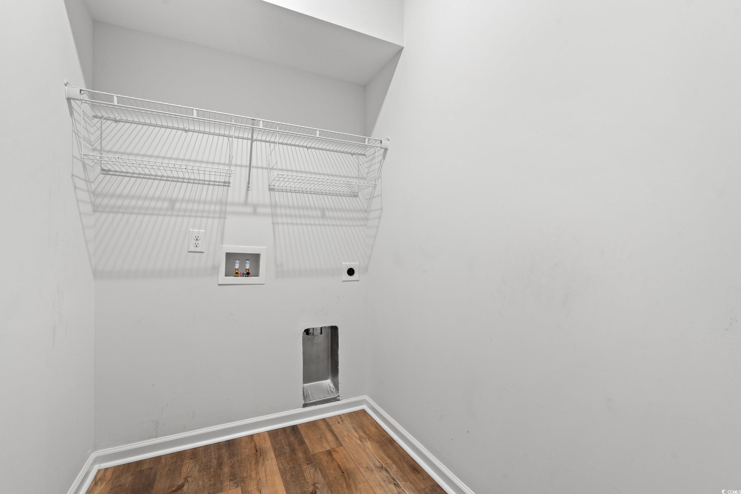 3026 Millstone Place Georgetown, SC 29440 - Photo 21 of 34 Laundry room featuring hookup for a washing machine, dark wood-style floors, and hookup for an electric dryer