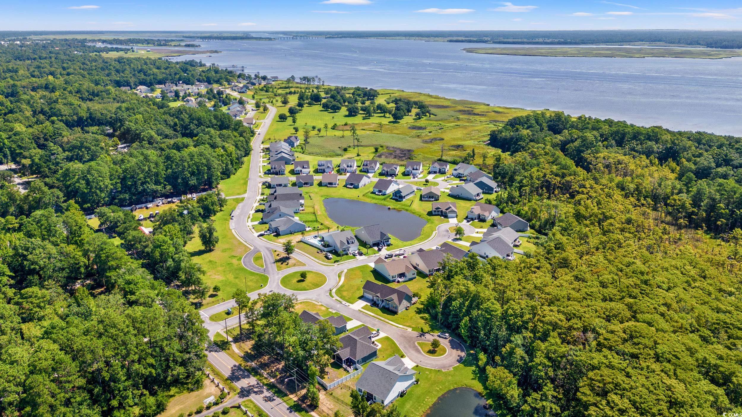 3026 Millstone Place Georgetown, SC 29440 - Photo 28 of 34 Aerial view of residential area featuring a large body of water