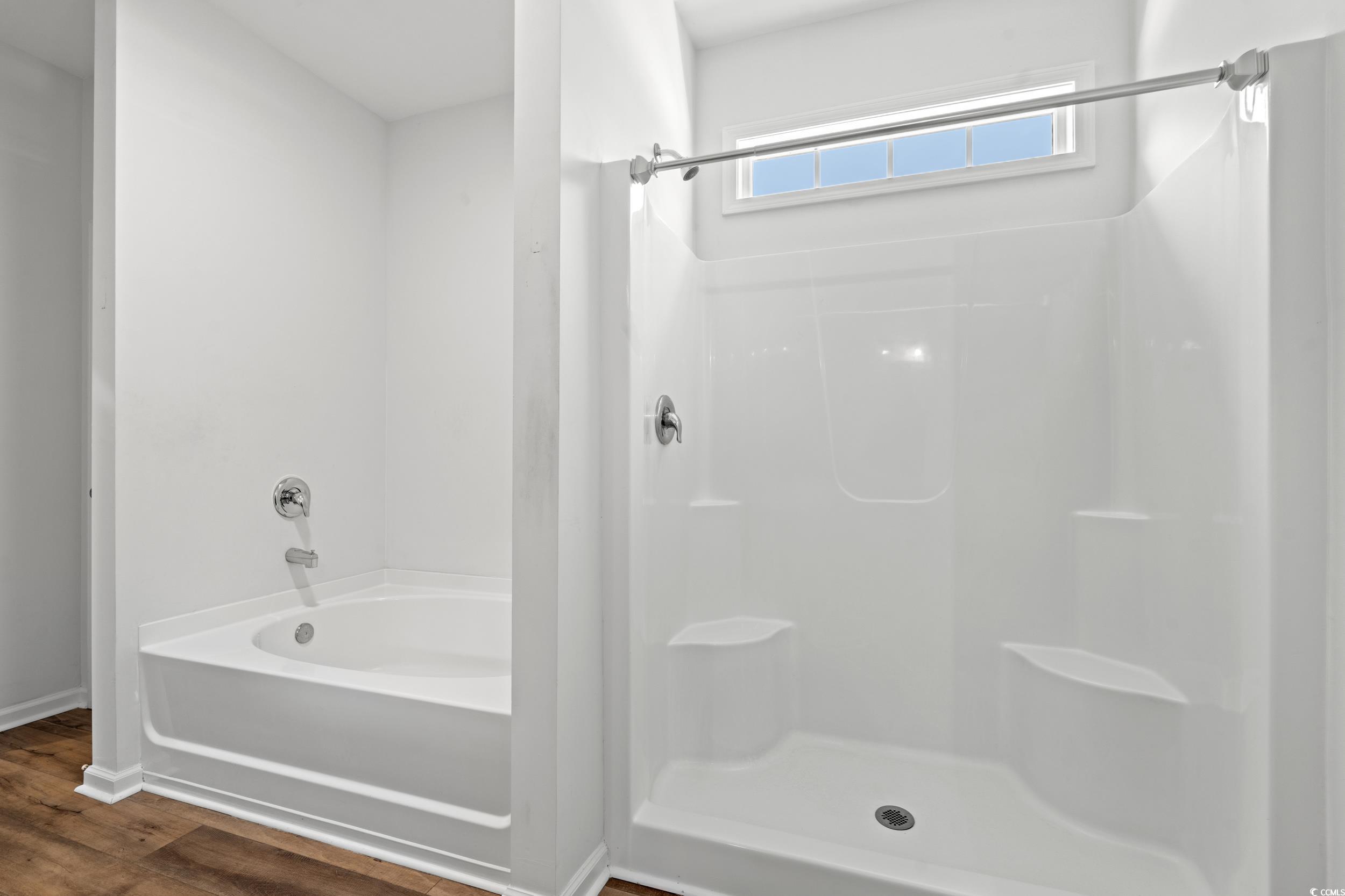 3026 Millstone Place Georgetown, SC 29440 - Photo 7 of 34 Full bath with a shower, a bathtub, and wood finished floors