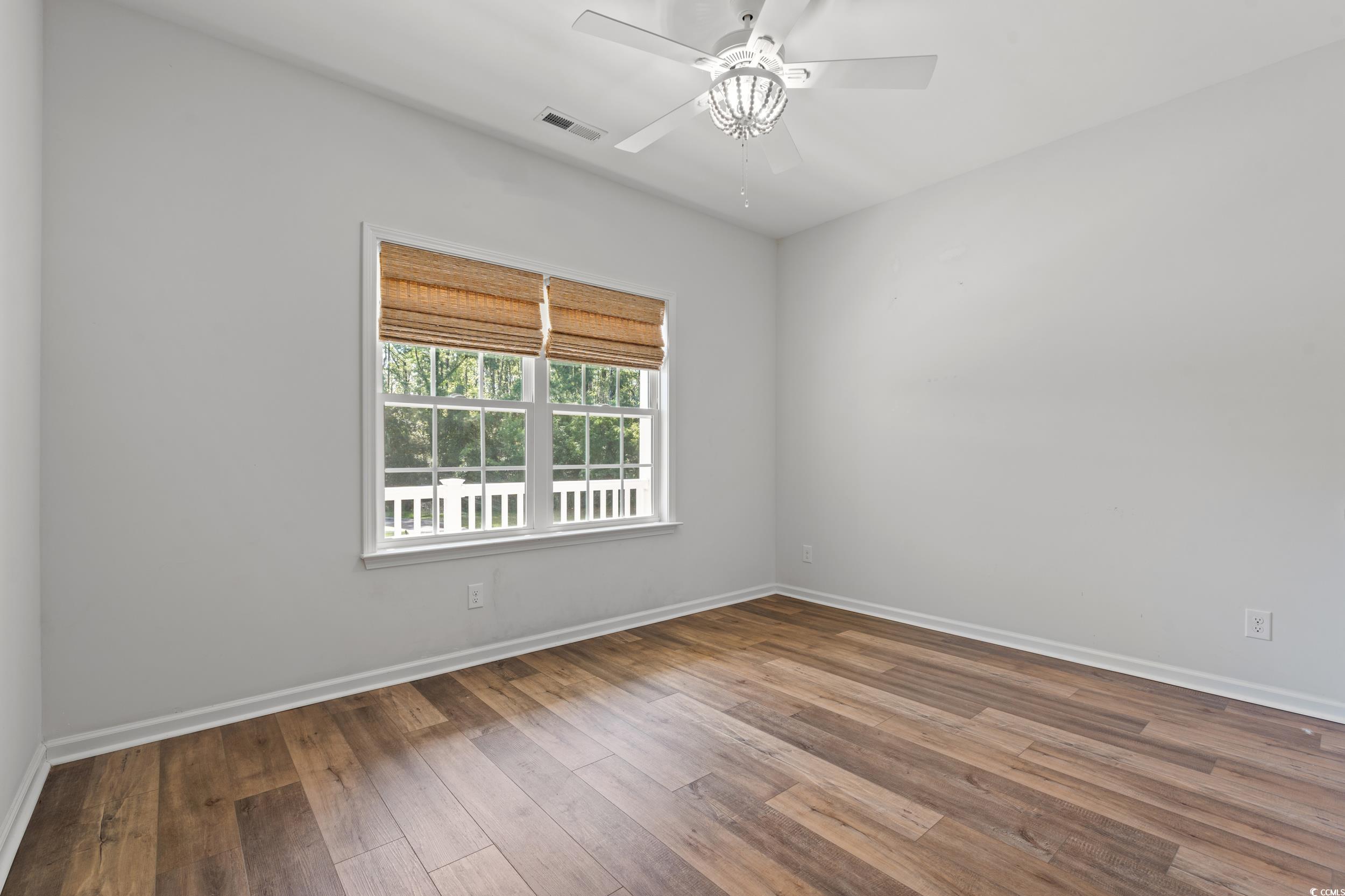 3026 Millstone Place Georgetown, SC 29440 - Photo 9 of 34 Spare room featuring LVP flooring and ceiling fan