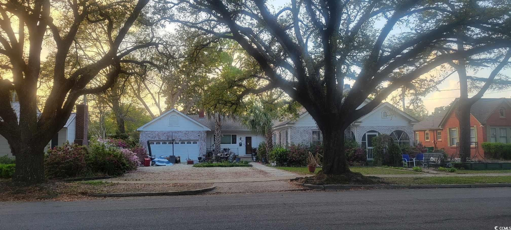 View of front of home featuring driveway and an attached garage