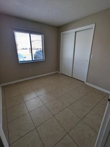 an empty room with mirror