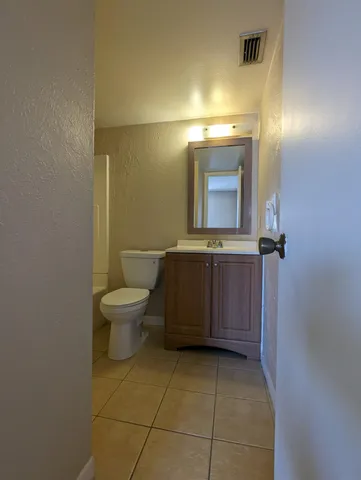 a bathroom with a toilet and a bath tub