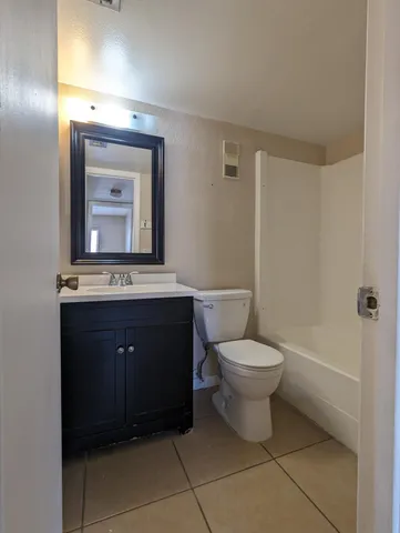 a bathroom with a shower and a toilet