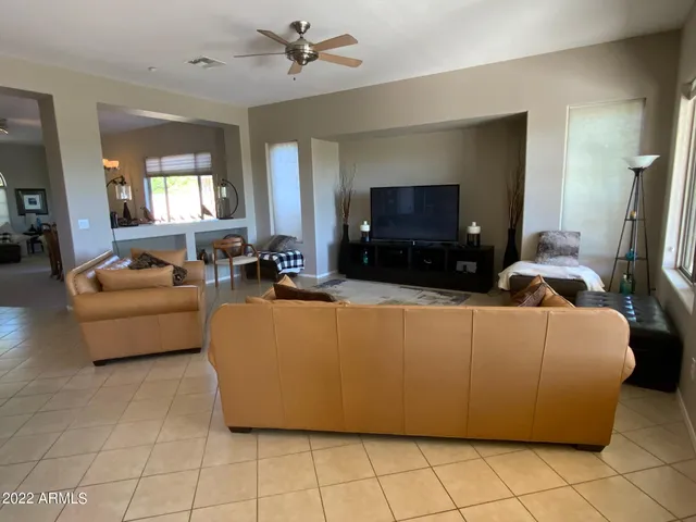 a bedroom with a bed and large window