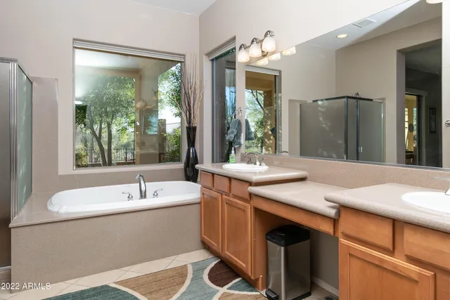 a bathroom with a sink vanity and a mirror