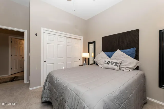 a view of a patio with table and chairs potted plants and large tree