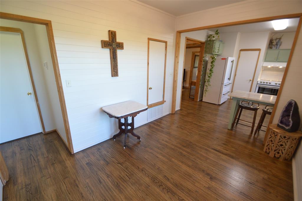 261 Red Road Howe, TX 75459 - Photo 14 of 40 a view of a hallway with wooden floor and furniture