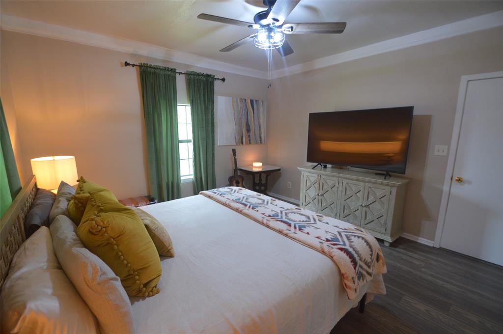 261 Red Road Howe, TX 75459 - Photo 21 of 40 a bedroom with a bed and a flat screen tv