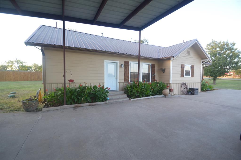 261 Red Road Howe, TX 75459 - Photo 4 of 40 a front view of a house with garden