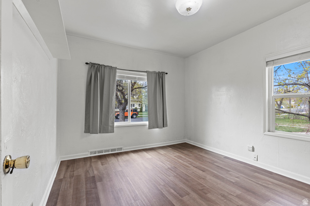 180 South 300 East Logan, UT 84321 - Photo 11 of 35 Empty room featuring vinyl floors and baseboards