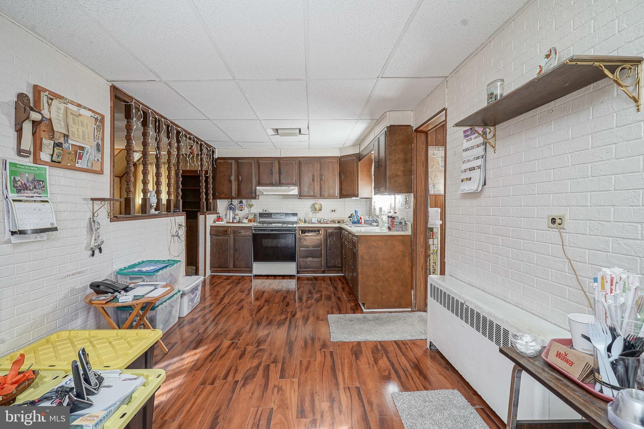 1925 Good Intent Road Woodbury, NJ 08096 - Photo 14 of 30 a kitchen with stainless steel appliances wooden floors and wooden cabinets