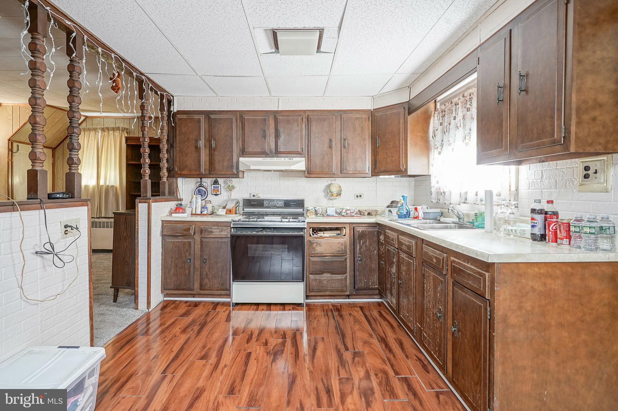 1925 Good Intent Road Woodbury, NJ 08096 - Photo 16 of 30 a kitchen with stainless steel appliances a sink dishwasher a refrigerator a stove and white cabinets with wooden floor