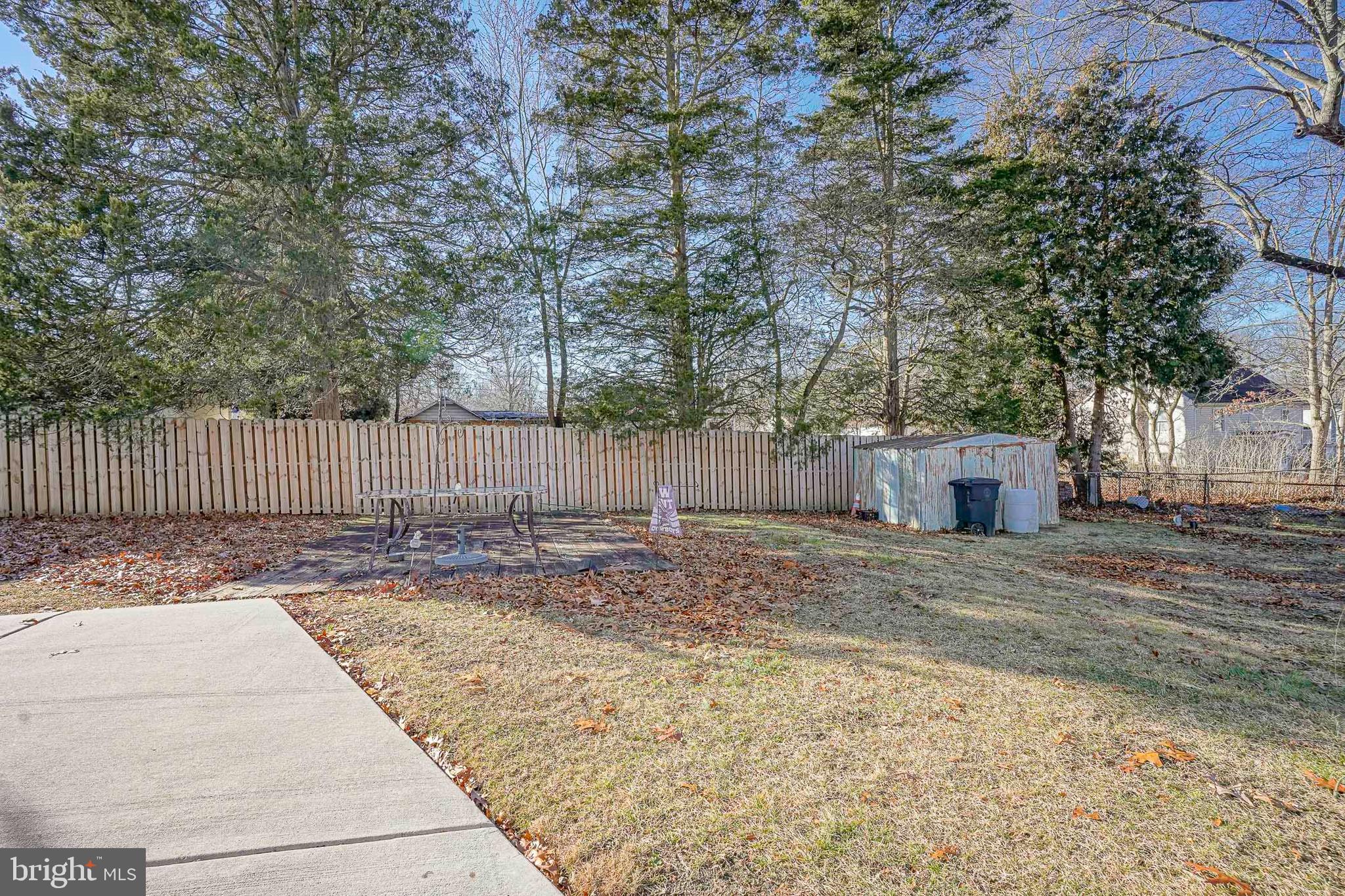 1925 Good Intent Road Woodbury, NJ 08096 - Photo 2 of 30 a view of a backyard with large trees and wooden fence