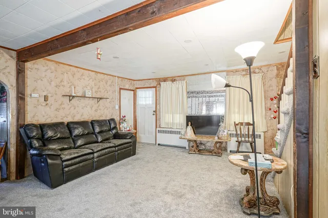 a living room with furniture and a couch