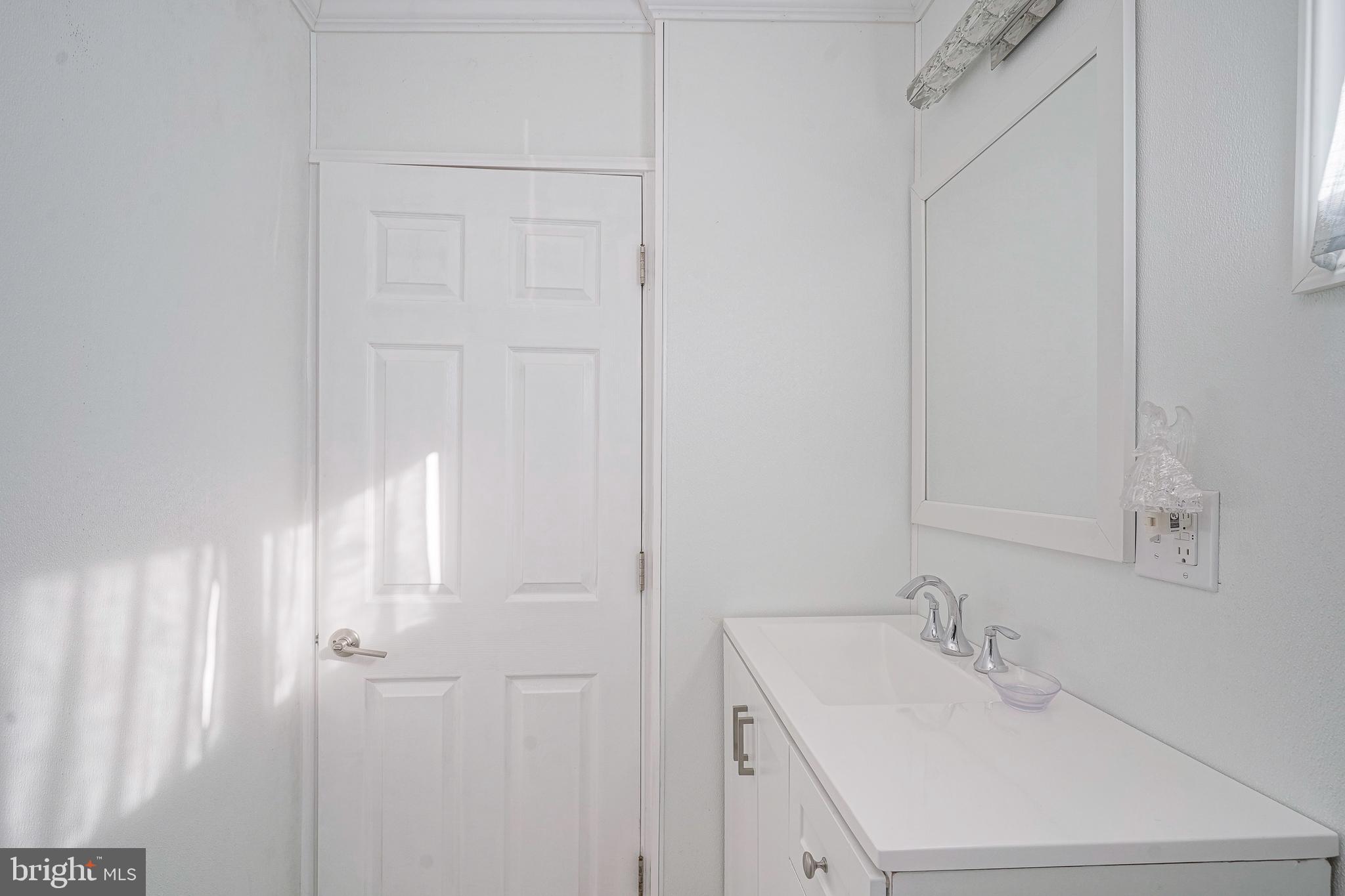1925 Good Intent Road Woodbury, NJ 08096 - Photo 6 of 30 a bathroom with a sink and a mirror