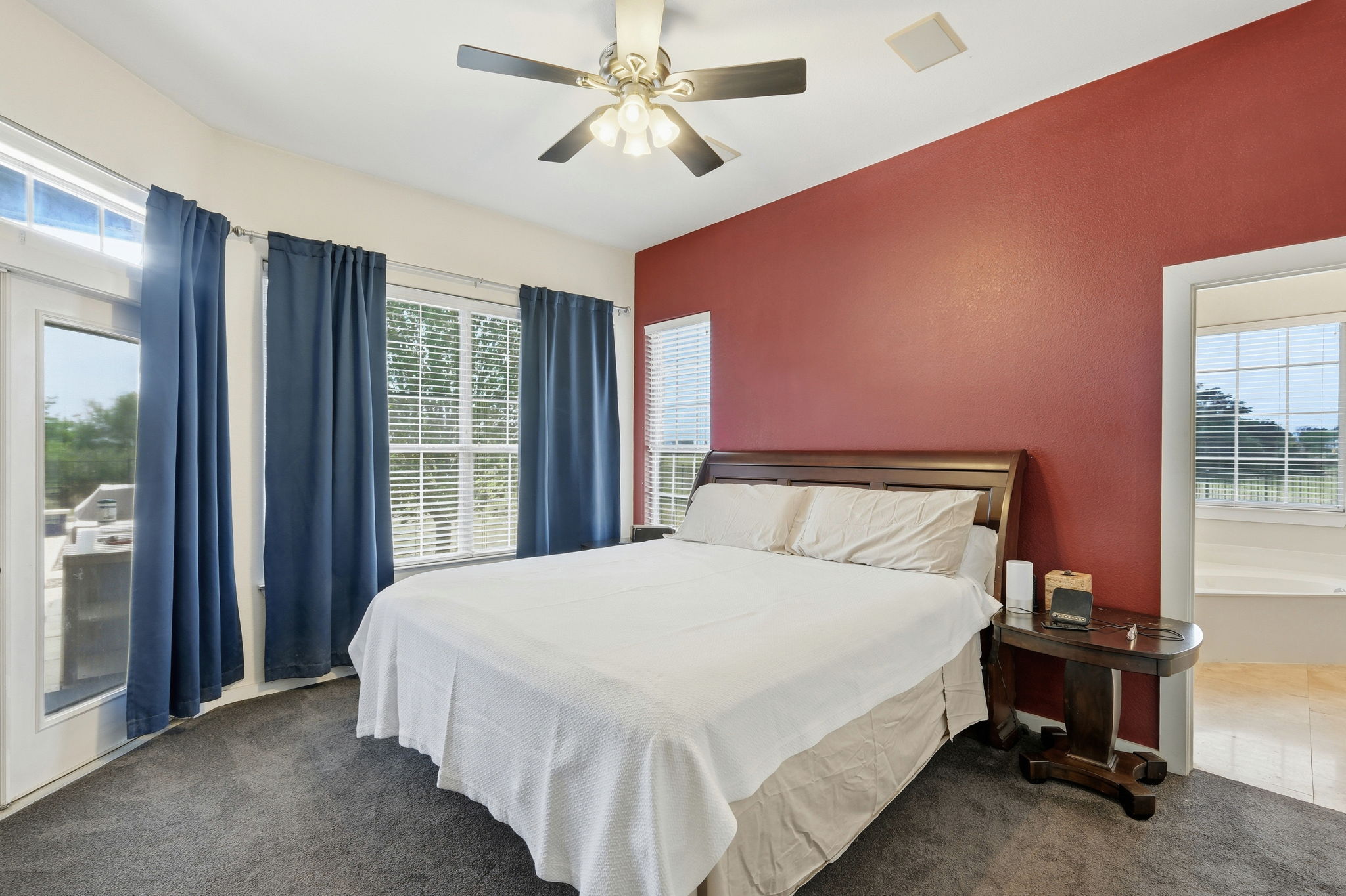 21007 Hodde Lane Pflugerville, TX 78660 - Photo 11 of 30 a large bed sitting in a bedroom next to a window