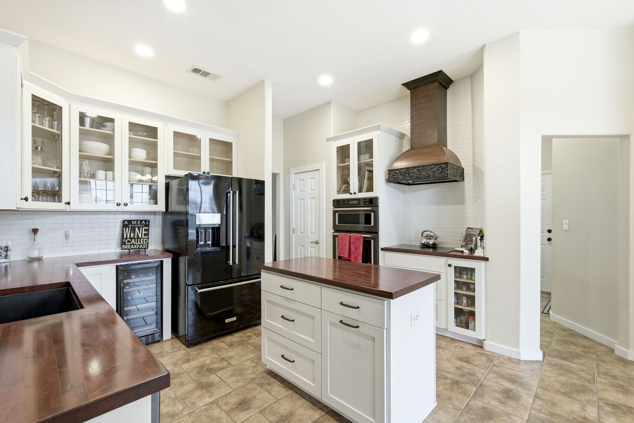 21007 Hodde Lane Pflugerville, TX 78660 - Photo 6 of 30 a kitchen with stainless steel appliances granite countertop a refrigerator sink and stove