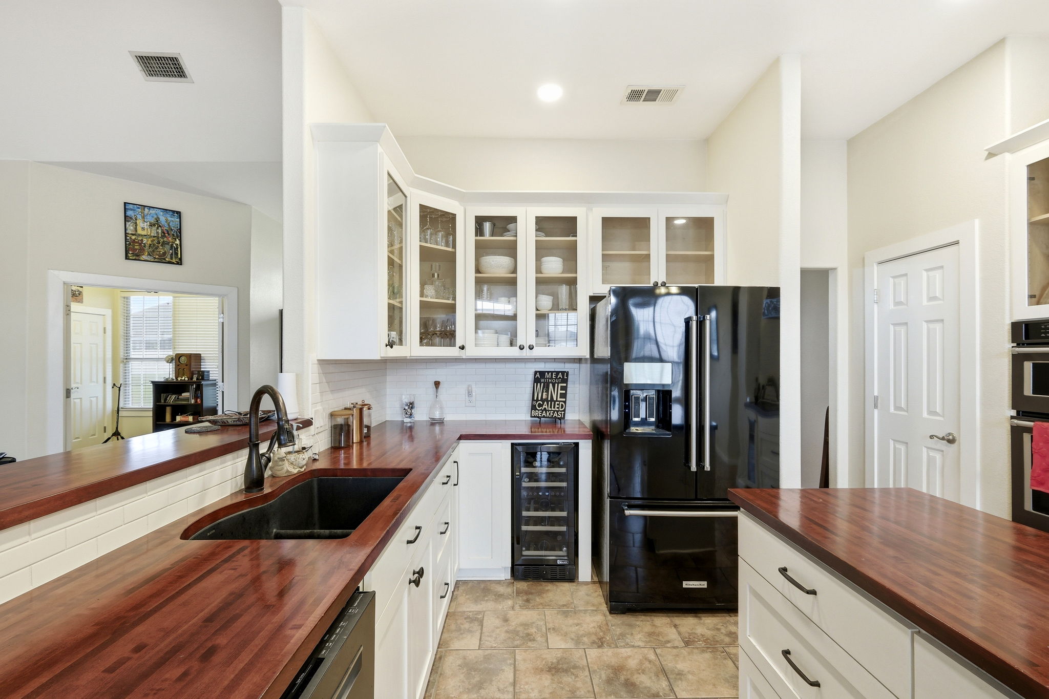 21007 Hodde Lane Pflugerville, TX 78660 - Photo 7 of 30 a kitchen with a refrigerator and a sink