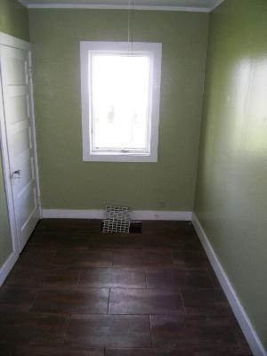 23W662 West Irving Park Road Roselle, IL 60172 - Photo 11 of 14 a view of a room with wooden floor and a window