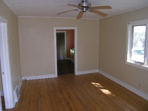 23W662 West Irving Park Road Roselle, IL 60172 - Photo 6 of 14 an empty room with wooden floor closet and windows