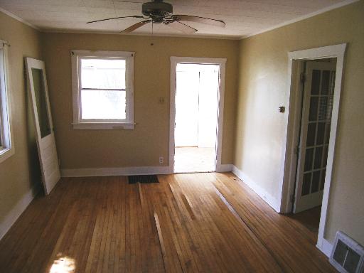 23W662 West Irving Park Road Roselle, IL 60172 - Photo 7 of 14 an empty room with wooden floor and a window