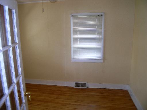 23W662 West Irving Park Road Roselle, IL 60172 - Photo 8 of 14 a view of a room with wooden floor and a window