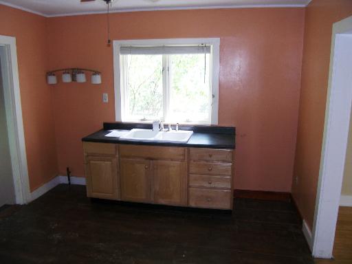 23W662 West Irving Park Road Roselle, IL 60172 - Photo 10 of 14 a bathroom with a sink and a mirror